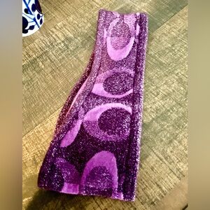Coach Shimmering Purple Hairband. 44% Wool . Excellent condition. One size.